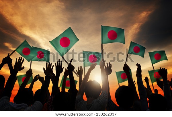 Silhouettes of\
People Holding Flag of\
Bangladesh
