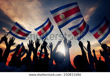 Silhouettes of People Holding Flag of Costa Rica