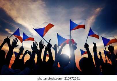 Silhouettes Of People Holding Flag Of Czech Republic