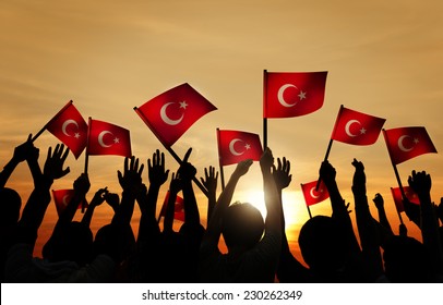 Silhouettes Of People Holding The Flag Of Turkey