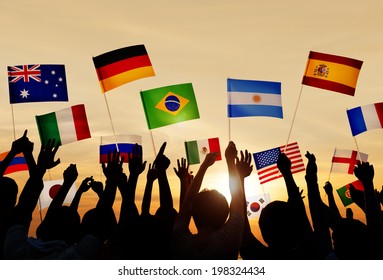 Silhouettes of People Holding Flags From Various Countries