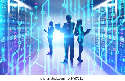 Silhouettes of people with laptops in server room with double exposure of circuits and lines of code. Concept of programming. Toned image