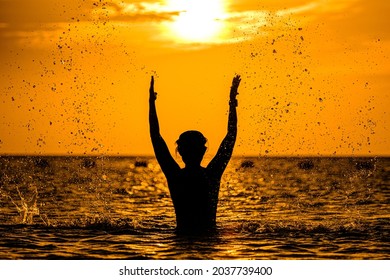 silhouettes of people on the sea, warm sunshine on the morning, at Haadrin beach, koh phangan, surathhani , thailand - Shutterstock ID 2037739400