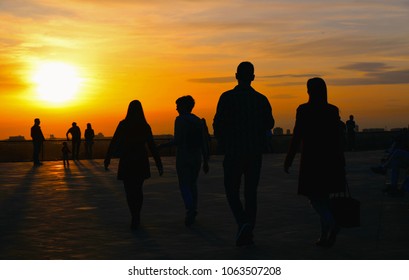 Silhouettes Of People On Warm Colorful Sunset In Belgrade, Serbia