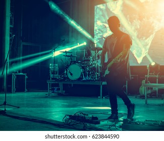 Silhouettes Of Rock Concert Crowd In Front Of Bright Stage Lights