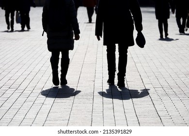 Silhouettes And Shadows Of People On The City Street. Crowd Walking Down On Sidewalk, Concept Of Strangers, Crime, Society Or Population