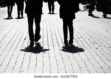 Silhouettes And Shadows Of People On The Street. Crowd Walking Down On Sidewalk, Concept Of Society And Population