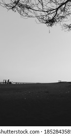 Silhouettes Of Siluet On The Sunset Background. Model Taking Image Of The Sunset. People On The Image - Unrecognizable. Orange Sunset - Golden Hour During Estonian Mid Summer Fest.on The Beach