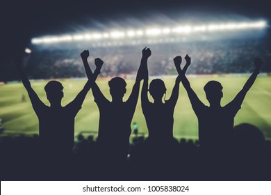 silhouettes of Soccer fans in a match and Spectators at football stadium