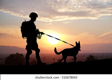 Silhouettes Of Soldier And Dog On Sunset Background. Military Service Concept.