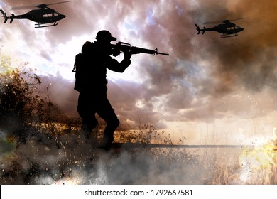 Silhouettes Of Soldier And Helicopters In Combat Zone. Military Service