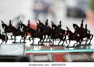 Silhouettes of soldier toys marching in second-hand shop window in Porvoo Finland - Powered by Shutterstock