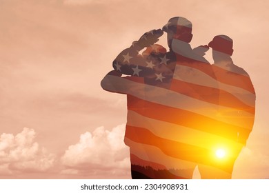 Silhouettes of soldiers with print of sunset and USA flag saluting on a background of light sky. Greeting card for Veterans Day, Memorial Day, Independence Day. America celebration.