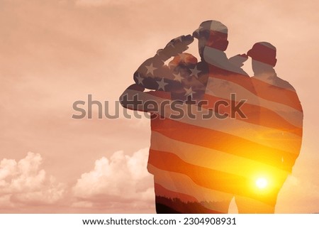 Silhouettes of soldiers with print of sunset and USA flag saluting on a background of light sky. Greeting card for Veterans Day, Memorial Day, Independence Day. America celebration.