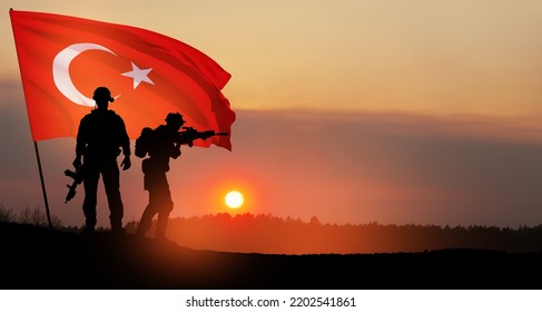 Silhouettes Of Soldiers With Turkey Flag On Background Of Sunset. Concept Of Crisis Of War And Political Conflicts Between Nations. Greeting Card For Turkish Armed Forces Day, Victory Day.