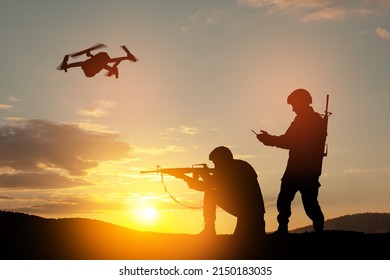 Silhouettes Of Soldiers Are Using Drone And Laptop Computer For Scouting During Military Operation.