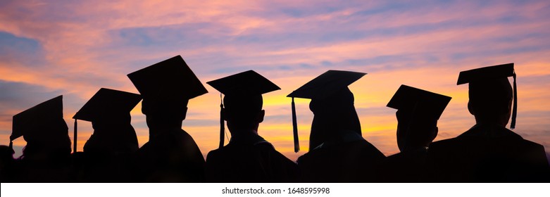 Silhouettes of students with graduate caps in a row on sunset background. Graduation ceremony at university web banner.