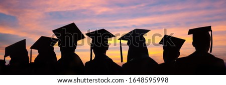 Silhouettes of students with graduate caps in a row on sunset background. Graduation ceremony at university web banner.