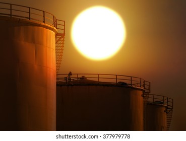 Silhouettes Tank Farm Oil On The Background Sunset