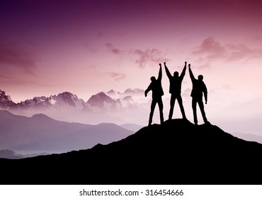 Silhouettes of team on mountain peak. Sport and active life concept

 - Shutterstock ID 316454666