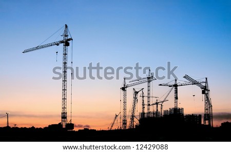 Similar – The sun sets and the cranes rise