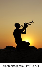 Silhouettes of trumpet player