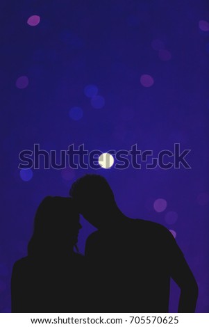 Silhouettes of a young couple under the starry sky. Elements of this image are my work only.