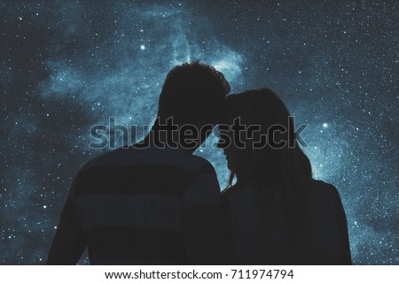 Silhouettes of a young couple under the starry sky. Elements of this image are my work.