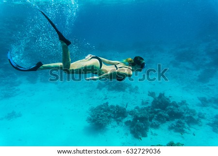 silhouettes of a young women free diving in the pacific ocean Stock photo © 