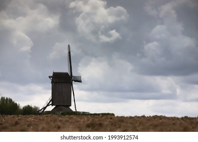 Silhoutte of old windmill in clouded sky