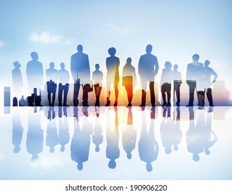 Silhouttes of Business People Looking Up in a Cityscape