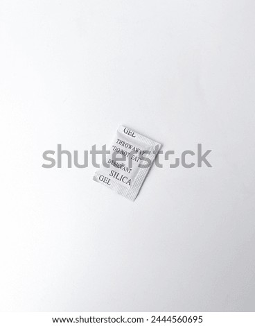 Silica gel do not eat desiccant paper pack packaging isolated on white colored studio background.