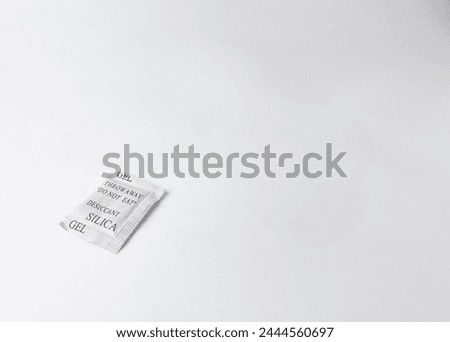 Silica gel do not eat desiccant paper pack packaging isolated on white colored studio background.