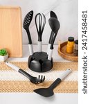 Silicon cooking utensil set including slotted spoon, slotted turner, pasta server, slotted spatula, deep soup ladle, solid spoon, kitchen tongs, egg whisk, basting brush, spreader spatula, hooks, hold