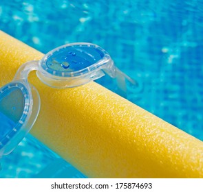 Silicon Goggles On A Yellow Pool Noodle