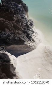 
Silicon Rock, A Sediment That Settles On Lava Rocks In A Blue Lagoon In Iceland. White Precipitate Of Silicon, Which Is Very Useful For The Skin, Therapy With Silicon Water From Thermal Sources.