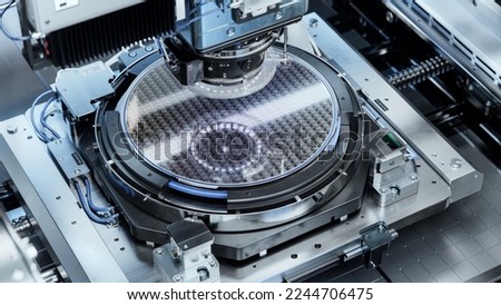 Silicon Wafer inside Photolithography Machine. Shot of Lithography Process that allows to Create Complex Patterns on a Wafer during Semiconductor and Computer Chip Manufacturing at Fab or Foundry.