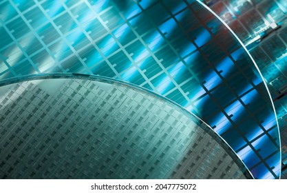 Silicon Wafer with microchips used in electronics for the fabrication of integrated circuits. - Shutterstock ID 2047775072
