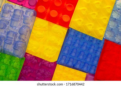 Silicone Bakeware Different Colors And Forms Hang On The Shelf Of The Store