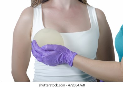 Silicone Breast Implant. Doctor Hold Silicone Breast Prosthesis