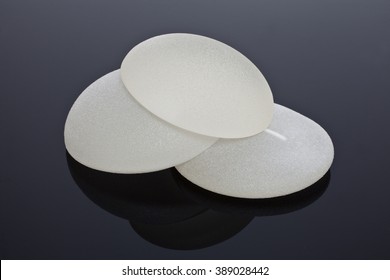 Silicone breast implants on black background, Silicone breast implants - Shutterstock ID 389028442