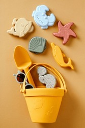 Silicone Bucket With Children's Toys For The Beach. Flat Lay, Top View.