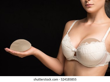 Silicone implants on hand and natural brest

