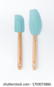 Silicone mixer and scraper spatula with bamboo handle on a white background