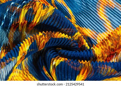 silk crimped. Blue, yellow, brown, burgundy colors. Ruffled silk fabric in vintage style. Floral pattern for elasticity. Opens the gathered fabric into pleasing and flattering folds.