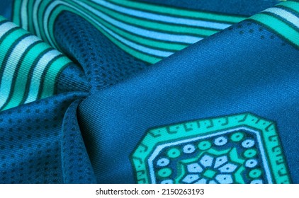 Silk fabric with a blue-green pattern. stripes. Find a prince, princess or anyone else who can hide behind the castle walls in our blue, green and geometric silk crepe de chine crepe de chine.