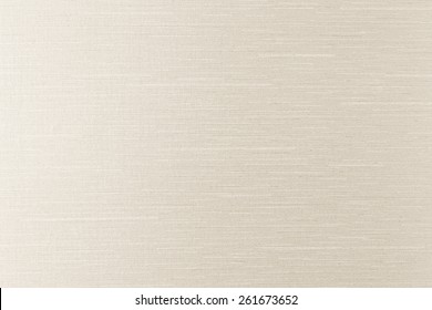 Silk fabric texture background in light sepia tone 