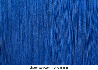 ฺBlue Silk On A Warping Loom Of A Textile Mill, Silk For Weaving On A Hand Loom, Hand Made Silk Process, Close Up Macro Detail Of Yarn Thread Lines Running In The Weaving Loom Machine. 