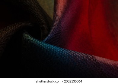 The silk scarf is dark in color  Green red blue blurred stripes  Delicate long gradient color stole  soft hand feeling  stylish   comfortable  The scarf will add sophistication to your look 