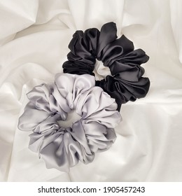 Silk Scrunchies on white. Flat lay Hairdressing accessories. Hair Scrunchies, Elastic HairBands.